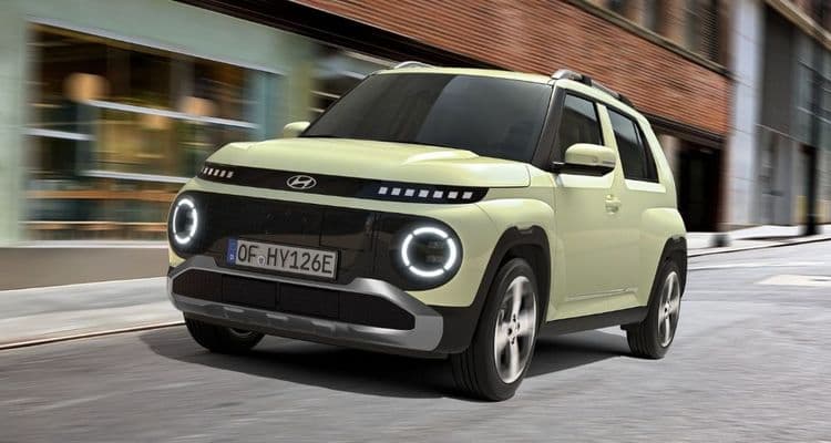 Hyundai INSTER in Buttercream Yellow drives in the city.