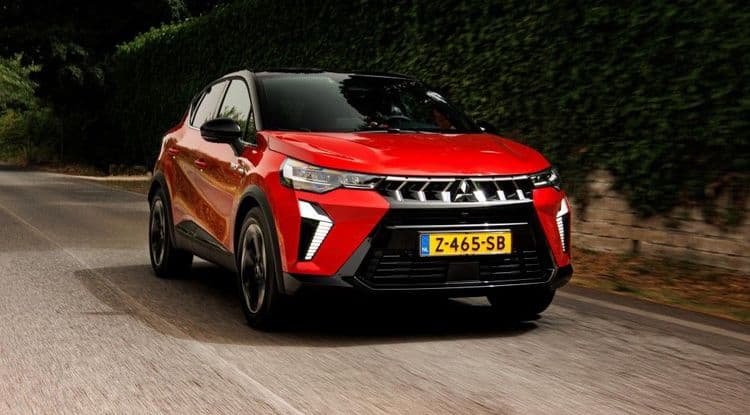 MItsubishi ASX 2024 in red drives on the road