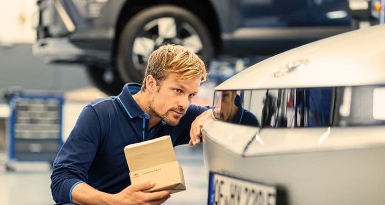 Vehicle mechatronics technician checks lights