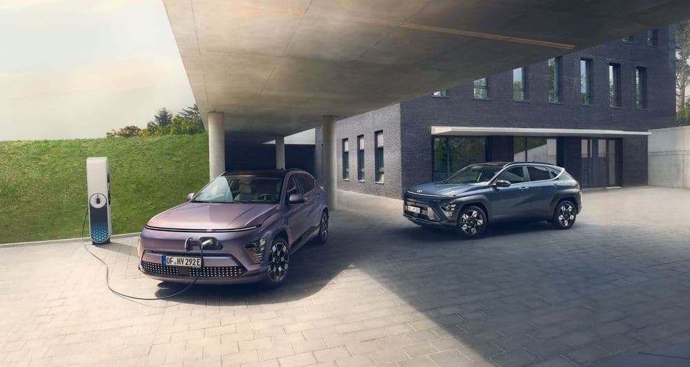Hyundai KONA Elektro in Meta Blue charges at charging station